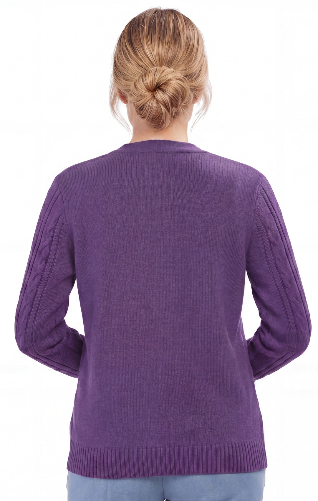 Purple sweater worn by a person on a white background