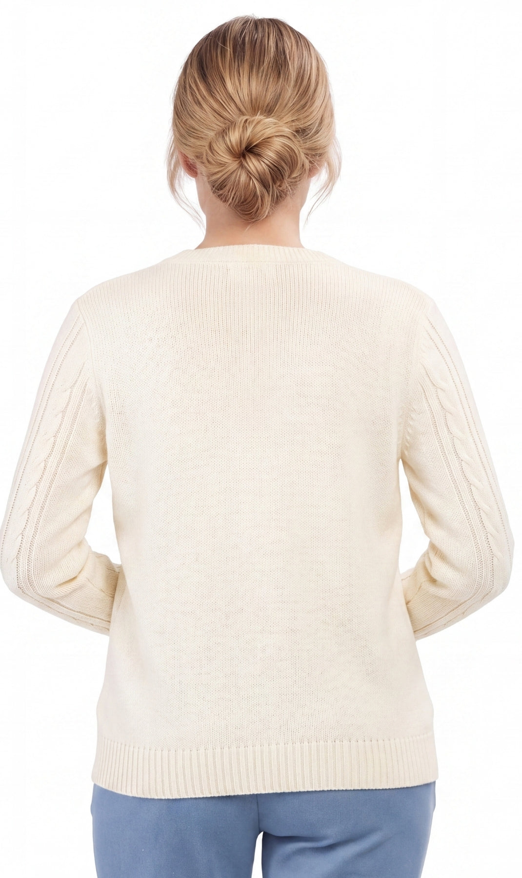 Back view of a person wearing a cream sweater on a white background